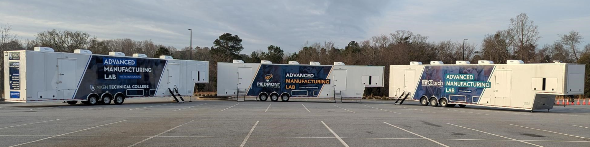 Exterior photo of three advanced manufacturing mobile labs